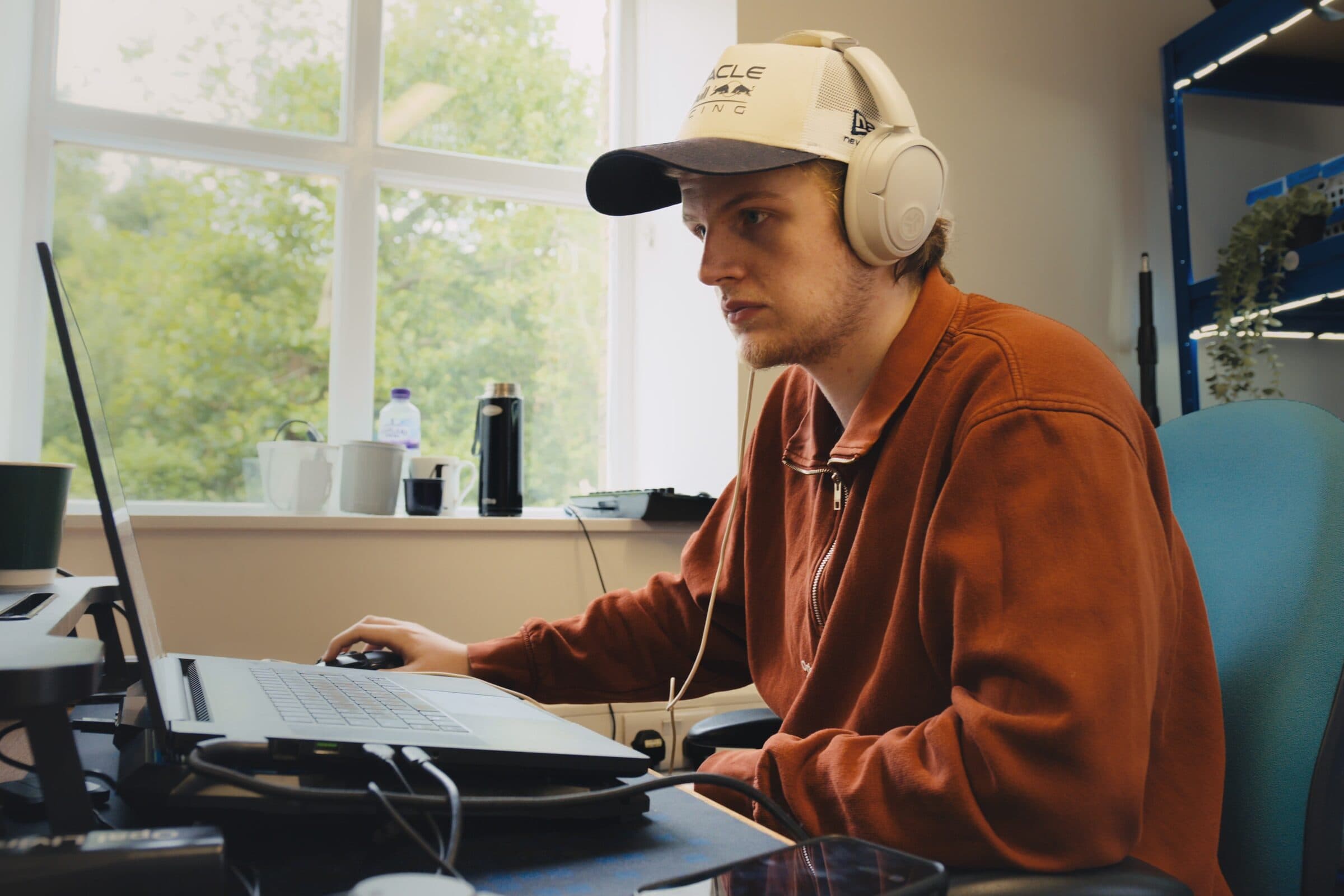 Josiah Murray editing video at his desk